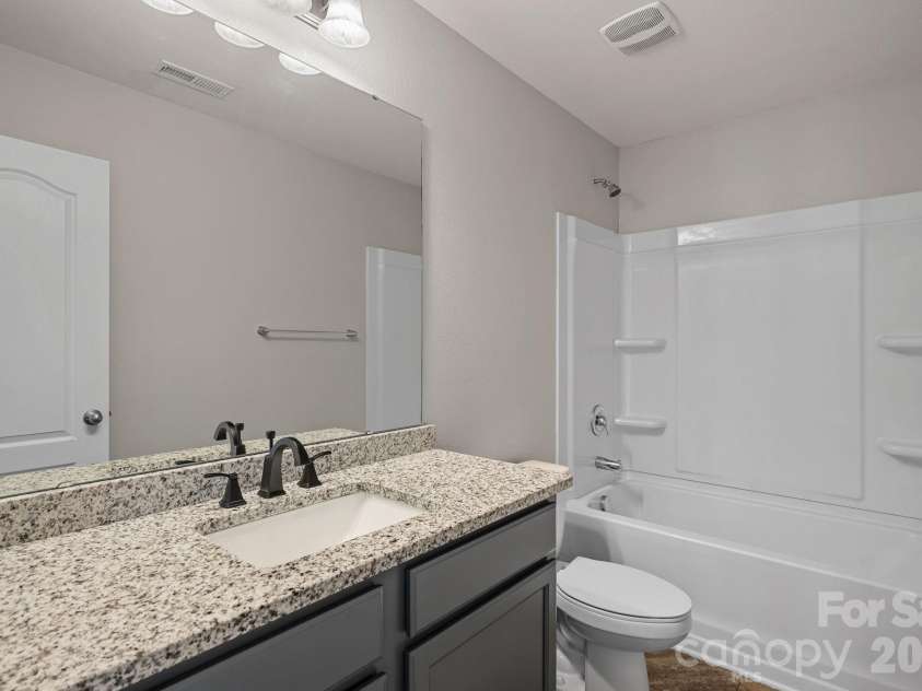 8226 Paw Valley Lane, Charlotte, NC 28214.  MLS# CAR4424539, YatesRealty ID 51583. Guest Bathroom