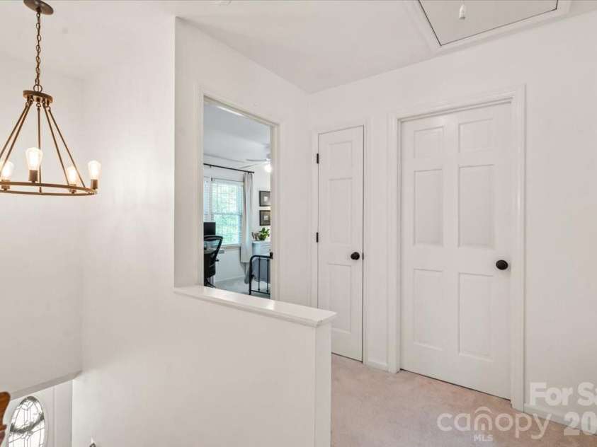 642 Furrow Drive, Charlotte, NC 28270.  MLS# CAR4424607, YatesRealty ID 51591. Upstairs landing with updated lighting