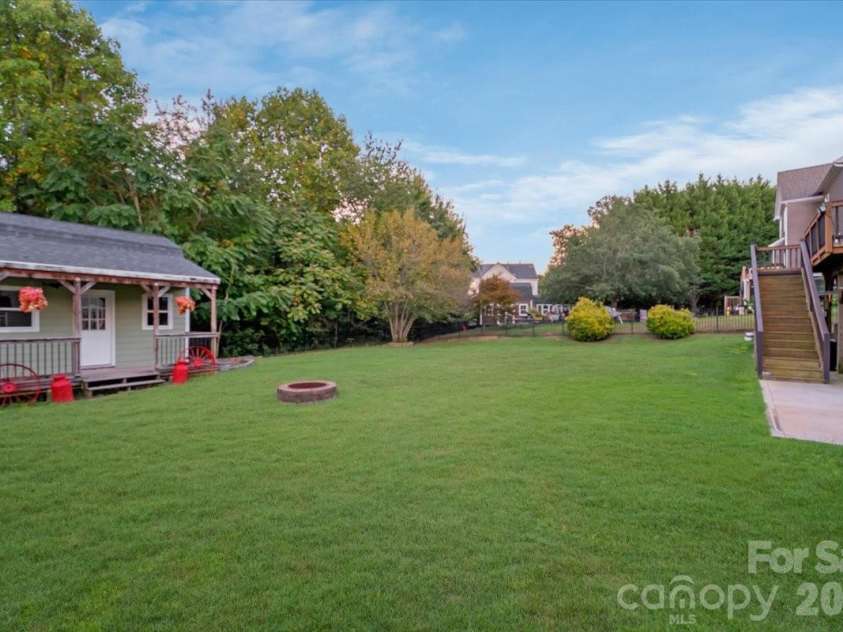 144 Steeplechase Avenue, Mooresville, NC 28117.  MLS# CAR4424163, YatesRealty ID 51592. Backyard with fire pit for those crisp fall evenings.
