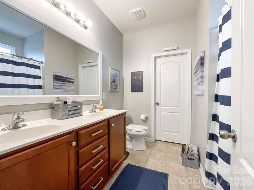 1401 Yellow Daisy Drive, Matthews, NC 28104.  MLS# CAR4424626, YatesRealty ID 51594. Primary Bathroom