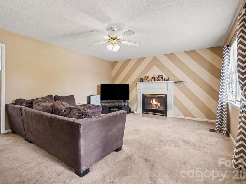 983 Farmington Court, Concord, NC 28025.  MLS# CAR4423644, YatesRealty ID 51599. LR with Ceiling Fan