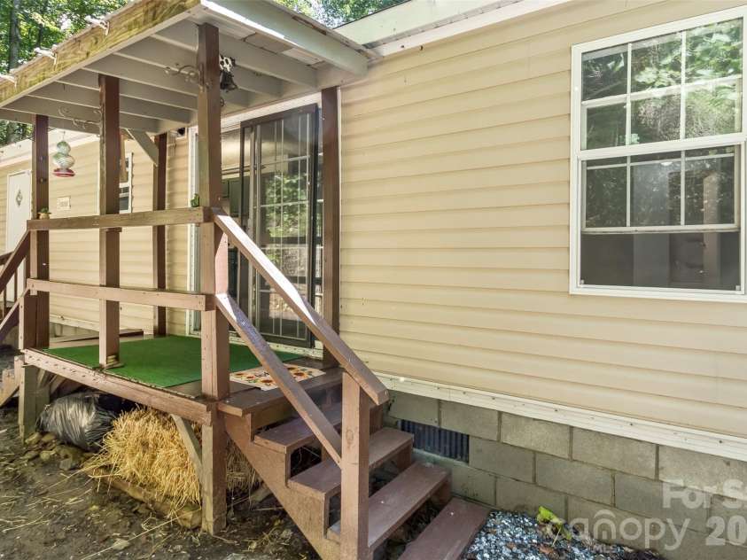 13 Cattail Drive, Sylva, NC 28779.  MLS# CAR4423552, YatesRealty ID 51604. Back porch, off Dining Room, could be expanded?