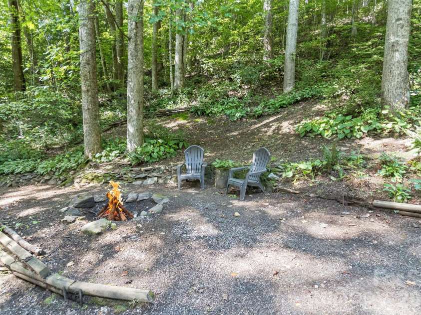 13 Cattail Drive, Sylva, NC 28779.  MLS# CAR4423552, YatesRealty ID 51604. Firepit for special evenings
