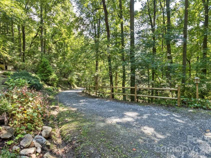 13 Cattail Drive, Sylva, NC 28779.  MLS# CAR4423552, YatesRealty ID 51604. Gorgeous fairy tale drive!