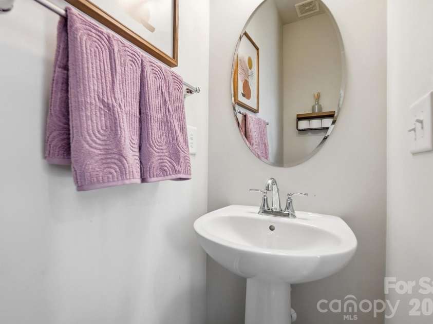 2606 Grantham Place Drive, Fort Mill, SC 29715.  MLS# CAR4423655, YatesRealty ID 51605. Half bath on 2nd floor