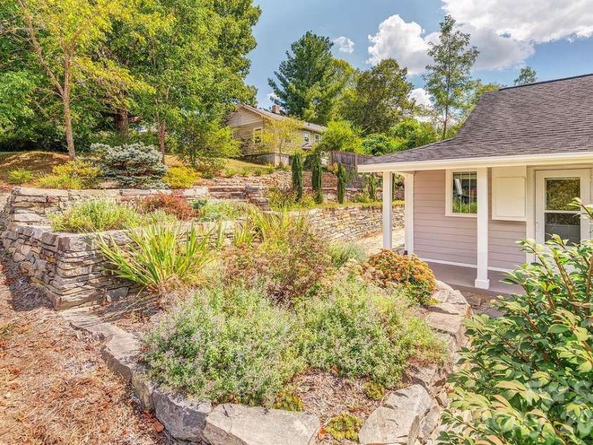 11 Temple Avenue, Asheville, NC 28804.  MLS# CAR4421842, YatesRealty ID 51613. Stonework, pathways, and mature gardens