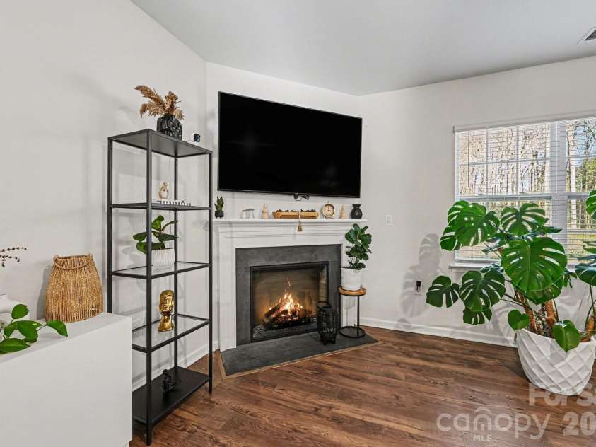 664 Saddlebred Lane, Locust, NC 28097.  MLS# CAR4360110, YatesRealty ID 5162. Family room with fireplace!