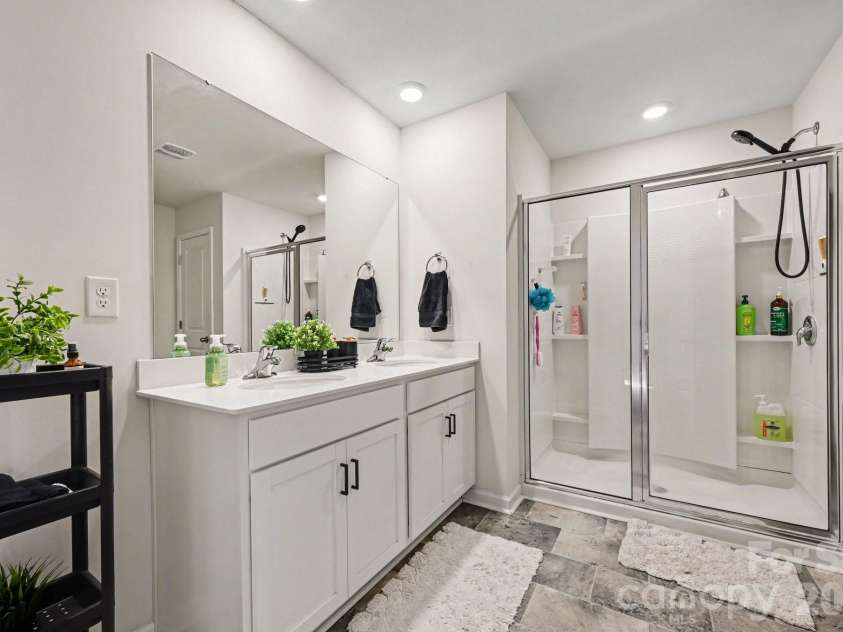 664 Saddlebred Lane, Locust, NC 28097.  MLS# CAR4360110, YatesRealty ID 5162. Primary bath with dual sinks and full sized shower