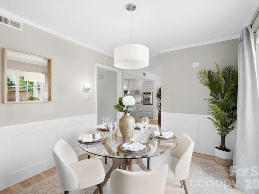 6816 Dumbarton Drive, Charlotte, NC 28210.  MLS# CAR4423174, YatesRealty ID 51621. Ample Sized Dining Room with Wainscoting