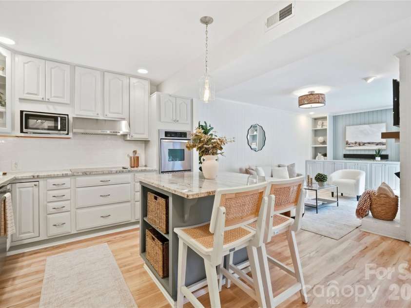 6816 Dumbarton Drive, Charlotte, NC 28210.  MLS# CAR4423174, YatesRealty ID 51621. Open Kitchen with Subway Tile Backsplash, Granite Counter Tops, and Stainless Steel Appliances