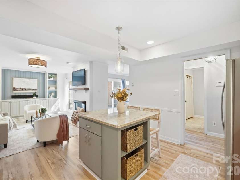 6816 Dumbarton Drive, Charlotte, NC 28210.  MLS# CAR4423174, YatesRealty ID 51621. Open Kitchen with Subway Tile Backsplash, Granite Counter Tops, and Stainless Steel Appliances