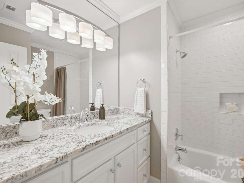 6816 Dumbarton Drive, Charlotte, NC 28210.  MLS# CAR4423174, YatesRealty ID 51621. Updated Primary Bathroom with Tall Vanity, Granite Vanity Top