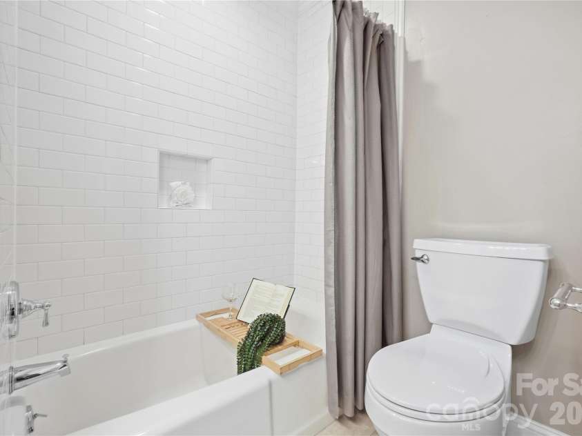6816 Dumbarton Drive, Charlotte, NC 28210.  MLS# CAR4423174, YatesRealty ID 51621. Updated Primary Bathroom with Tall Vanity, Granite Vanity Top
