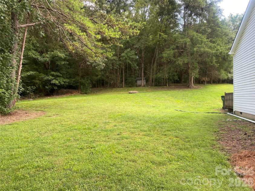 11101 Deerpath Court, Charlotte, NC 28262.  MLS# CAR4420188, YatesRealty ID 51623. Space between neighbors