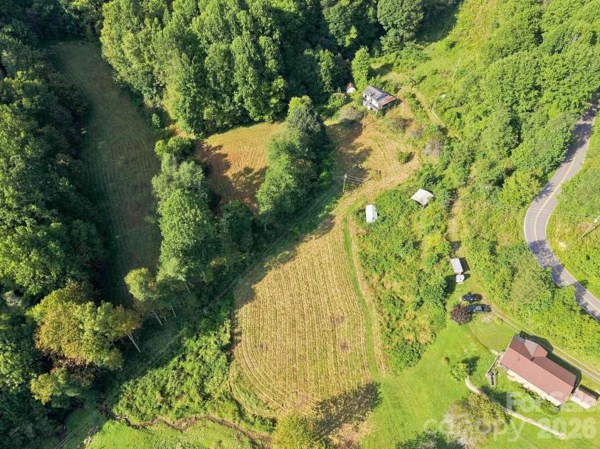 1487 Poplar Gap Road, Hot Springs, NC 28754.  MLS# CAR4420401, YatesRealty ID 51628. Field on property