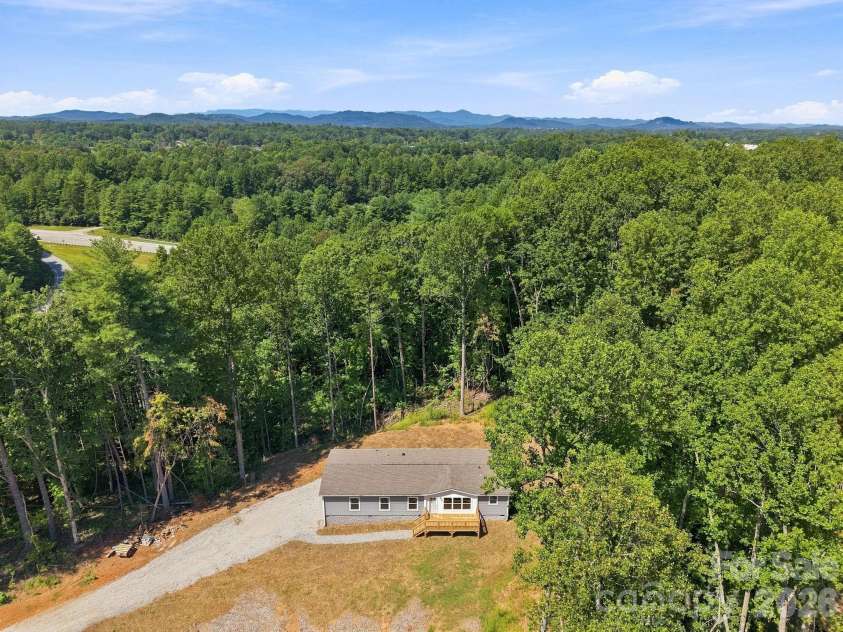 93 Foxcroft Lane, Flat Rock, NC 28792.  MLS# CAR4414955, YatesRealty ID 51640. Closer Drone View