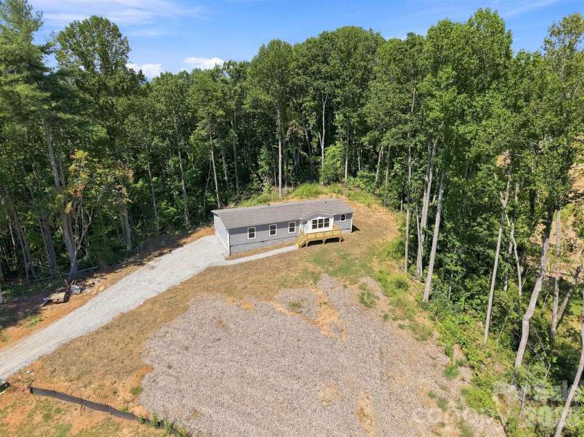 93 Foxcroft Lane, Flat Rock, NC 28792.  MLS# CAR4414955, YatesRealty ID 51640. Drone View of Front