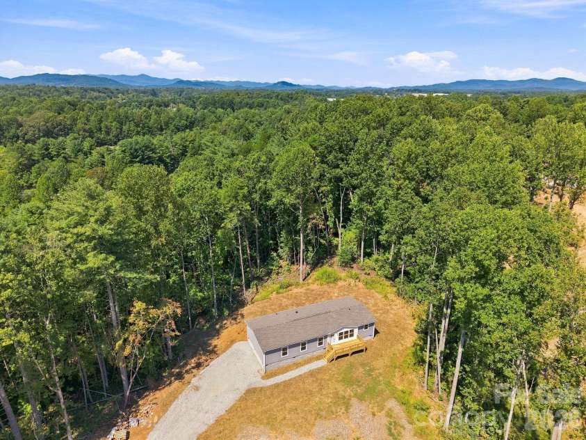93 Foxcroft Lane, Flat Rock, NC 28792.  MLS# CAR4414955, YatesRealty ID 51640. Drone View of Home and  Lot