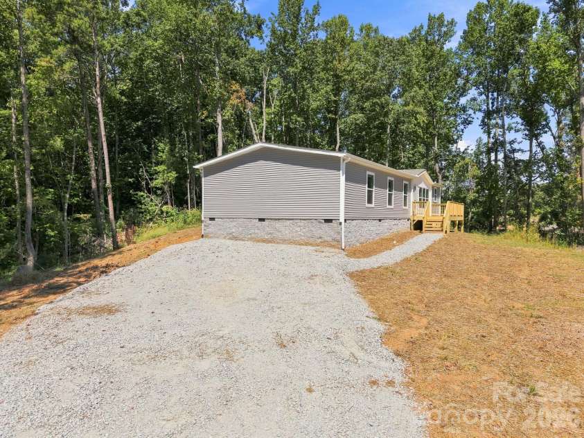 93 Foxcroft Lane, Flat Rock, NC 28792.  MLS# CAR4414955, YatesRealty ID 51640. Front View from Driveway
