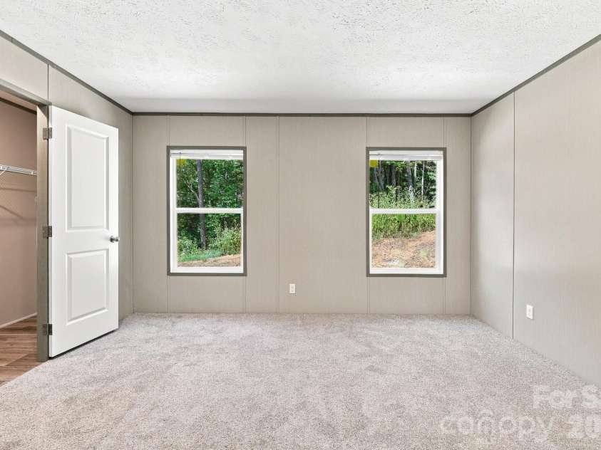 93 Foxcroft Lane, Flat Rock, NC 28792.  MLS# CAR4414955, YatesRealty ID 51640. Primary Bedroom