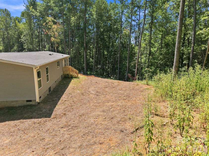 93 Foxcroft Lane, Flat Rock, NC 28792.  MLS# CAR4414955, YatesRealty ID 51640. View of Rear