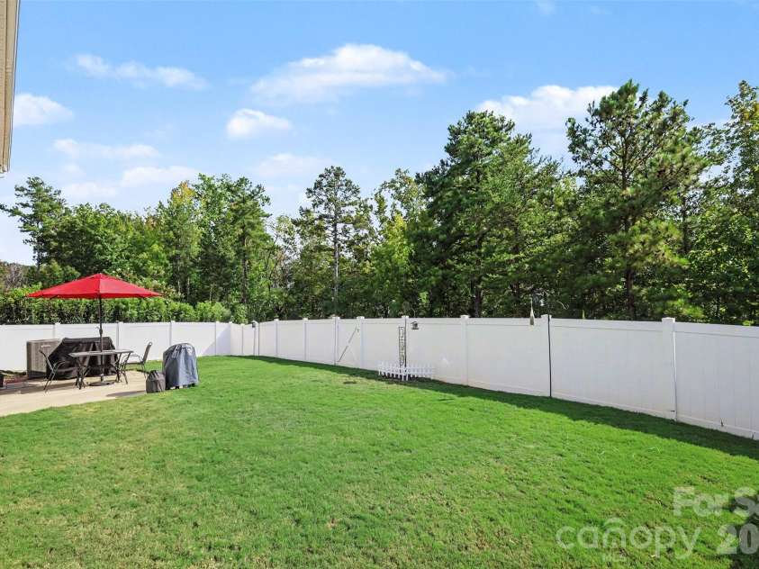 1571 Loggerhead Drive, Lancaster, SC 29720.  MLS# CAR4425185, YatesRealty ID 51644. Backyard that backs to the wood