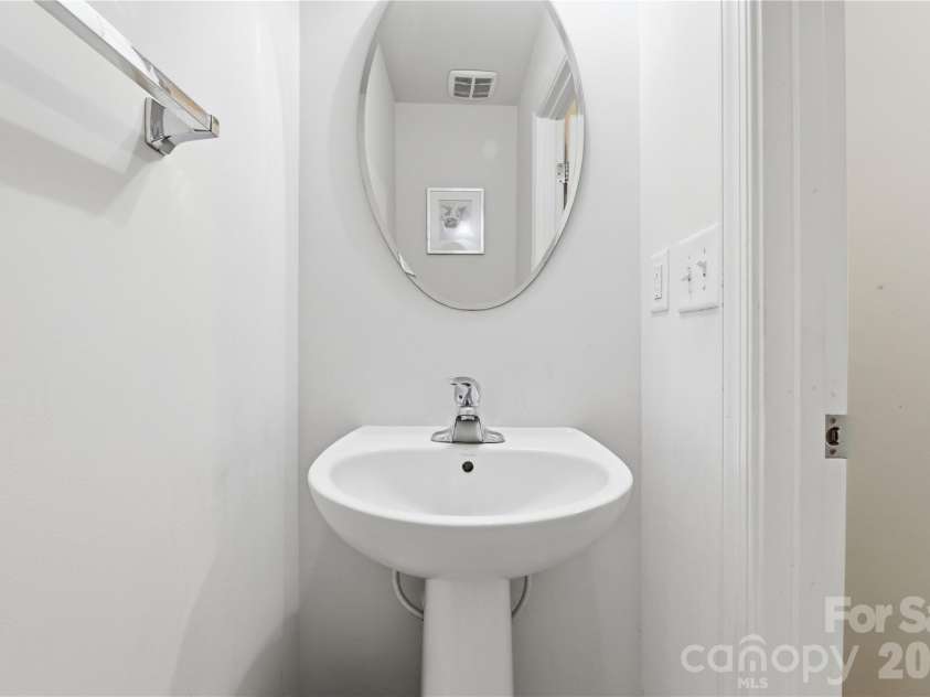 3341 Linetender Drive, Davidson, NC 28036.  MLS# CAR4425656, YatesRealty ID 51645. Powder Room: Convenient main-level powder room ideally positioned for guests and everyday use.