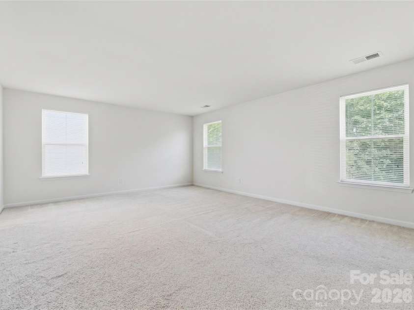 3341 Linetender Drive, Davidson, NC 28036.  MLS# CAR4425656, YatesRealty ID 51645. Primary Bedroom: Oversized primary suite with abundant natural light and room for a sitting area.