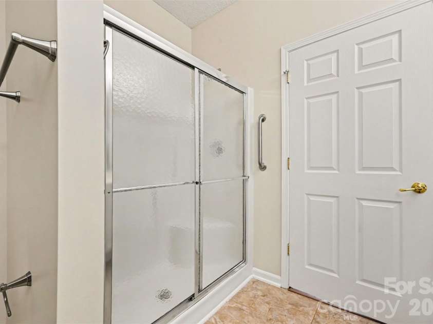 12114 Groth Court, Charlotte, NC 28277.  MLS# CAR4400315, YatesRealty ID 5165. Primary shower