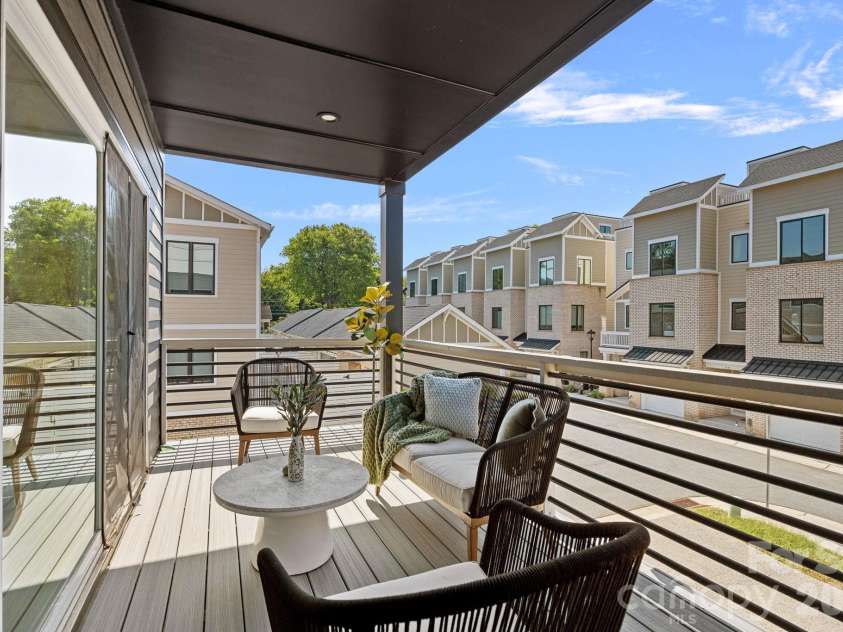 910 Van Every Street, Charlotte, NC 28205.  MLS# CAR4424577, YatesRealty ID 51651. Covered balcony off kitchen/dining area