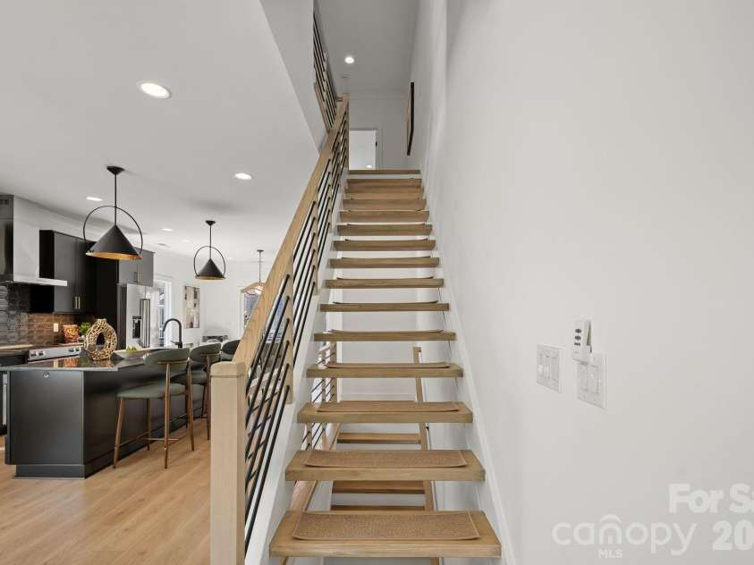 910 Van Every Street, Charlotte, NC 28205.  MLS# CAR4424577, YatesRealty ID 51651. Open-tread staircase