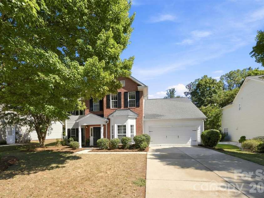 8709 Ellington Park Drive, Charlotte, NC 28277.  MLS# CAR4425738, YatesRealty ID 51656. Front view with mature tree