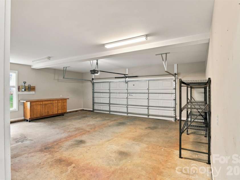 1524 Garrett Landen Drive, Clover, SC 29710.  MLS# CAR4418326, YatesRealty ID 51658. Attached 2 car garage has plenty of storage and a rolling work bench with cabinet access below from both sides!