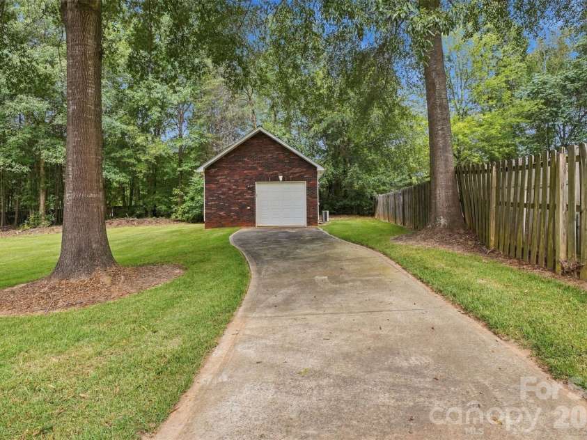 1524 Garrett Landen Drive, Clover, SC 29710.  MLS# CAR4418326, YatesRealty ID 51658. Detached garage/workshop inside privacy-fenced-in backyard
