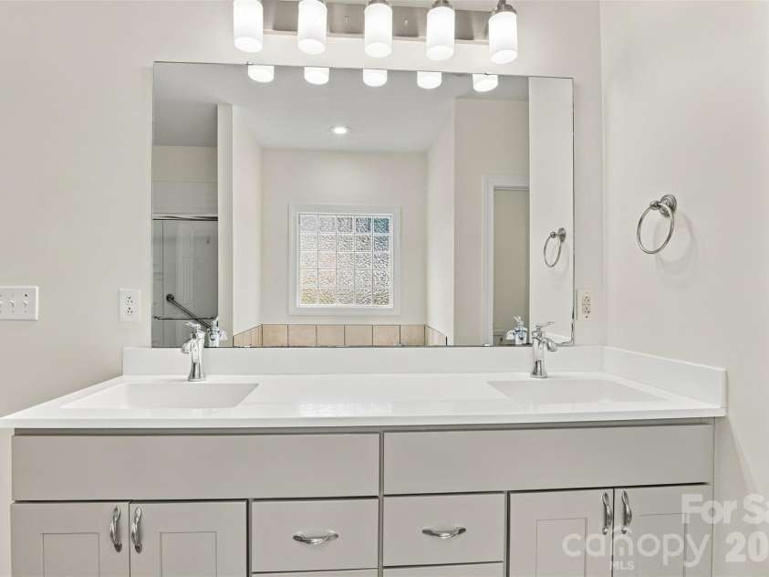1524 Garrett Landen Drive, Clover, SC 29710.  MLS# CAR4418326, YatesRealty ID 51658. Freshly painted primary bath double sink vanity!