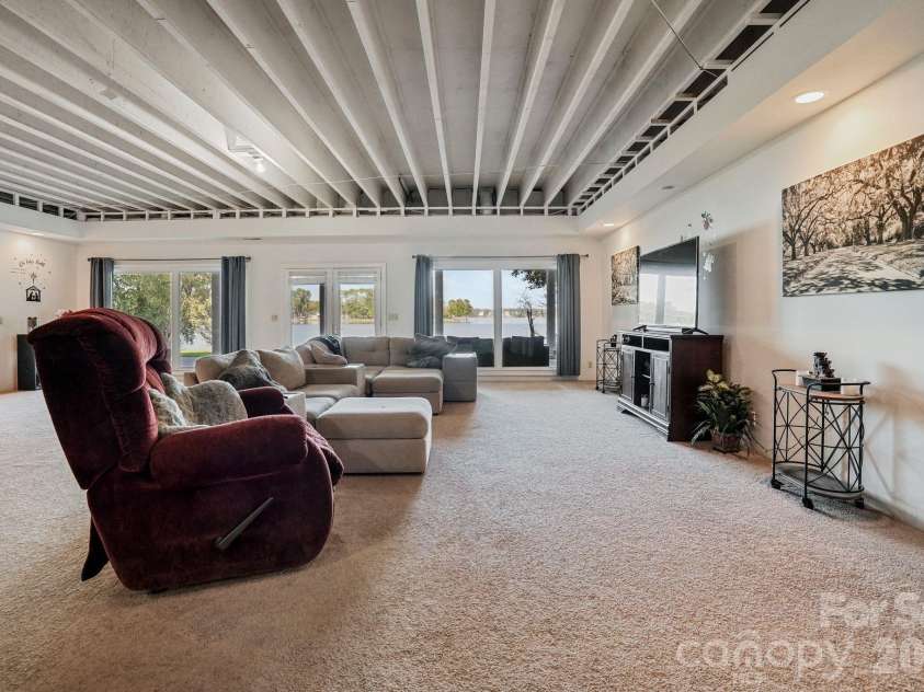 2159 Mingus Lane, York, SC 29745.  MLS# CAR4426084, YatesRealty ID 51661. Basement living room