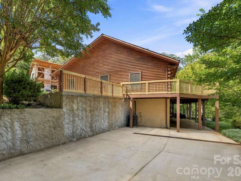 134 Raleigh Drive, Lake Lure, NC 28746.  MLS# CAR4423634, YatesRealty ID 51670. Basement level driveway.