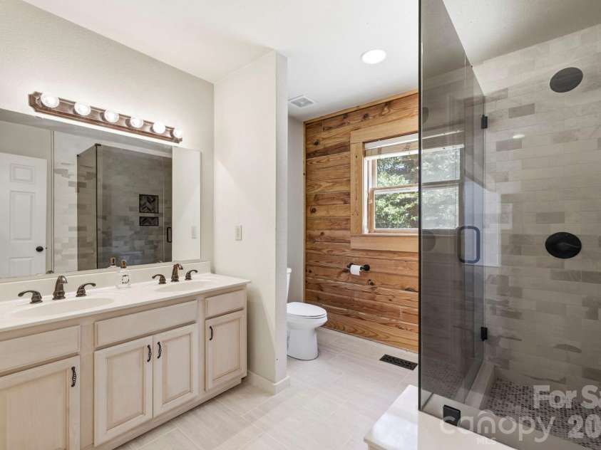 134 Raleigh Drive, Lake Lure, NC 28746.  MLS# CAR4423634, YatesRealty ID 51670. Guest bath main level.