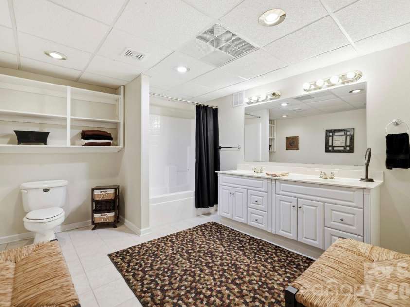 134 Raleigh Drive, Lake Lure, NC 28746.  MLS# CAR4423634, YatesRealty ID 51670. Large lower level full bath.