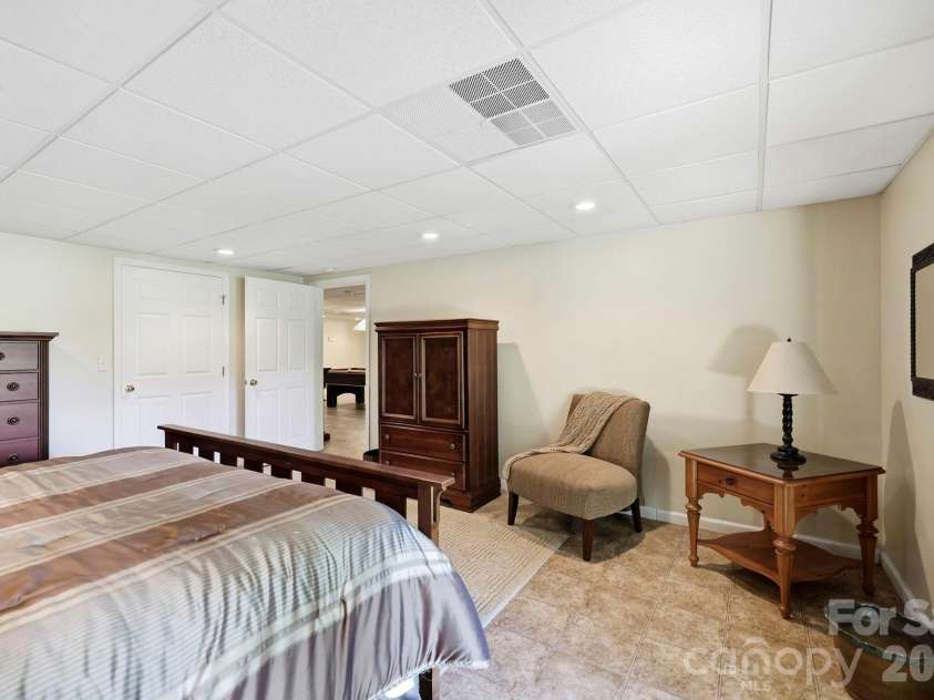 134 Raleigh Drive, Lake Lure, NC 28746.  MLS# CAR4423634, YatesRealty ID 51670. Lower level guest room