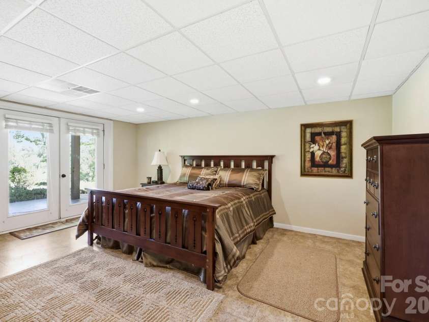 134 Raleigh Drive, Lake Lure, NC 28746.  MLS# CAR4423634, YatesRealty ID 51670. Lower level guest room with a view.