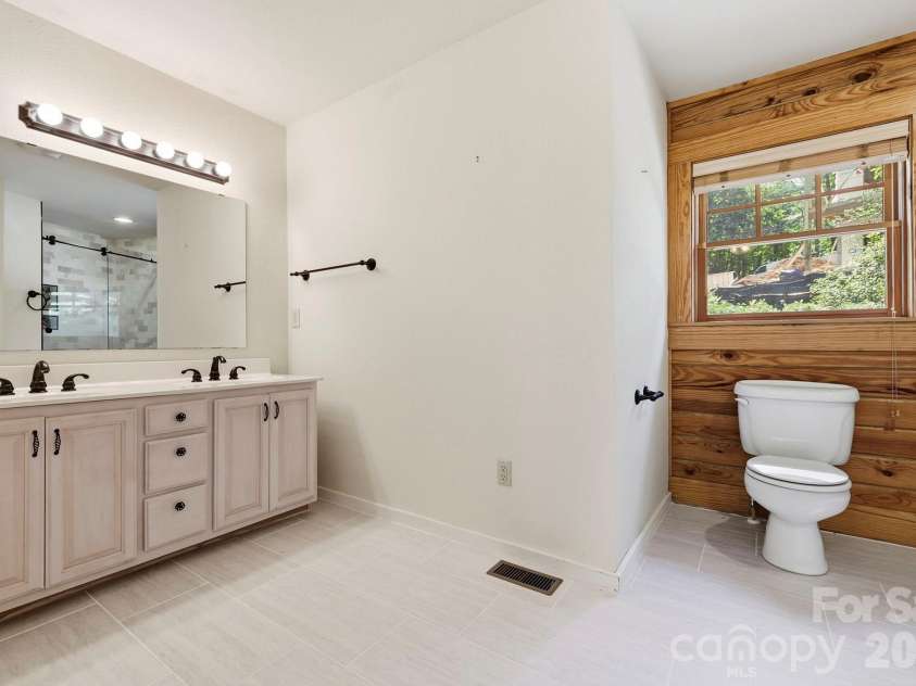 134 Raleigh Drive, Lake Lure, NC 28746.  MLS# CAR4423634, YatesRealty ID 51670. Primary bath view one.