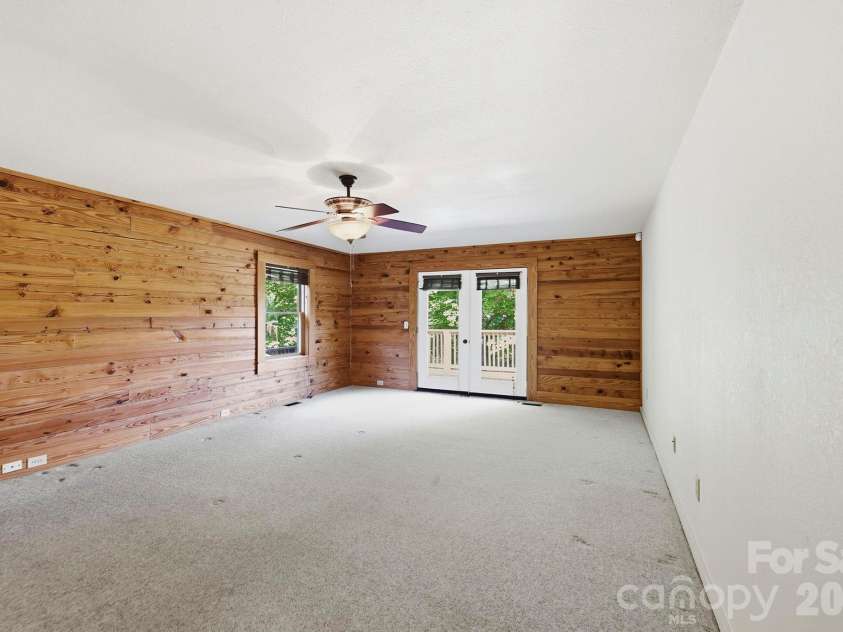 134 Raleigh Drive, Lake Lure, NC 28746.  MLS# CAR4423634, YatesRealty ID 51670. Primary bedroom with view, main level.