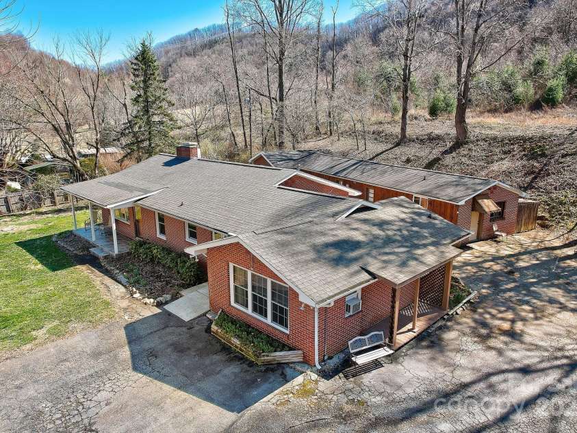 2541 Dellwood Road, Waynesville, NC 28786.  MLS# CAR4243546, YatesRealty ID 5168. Drone view showing how buildings sit on lot