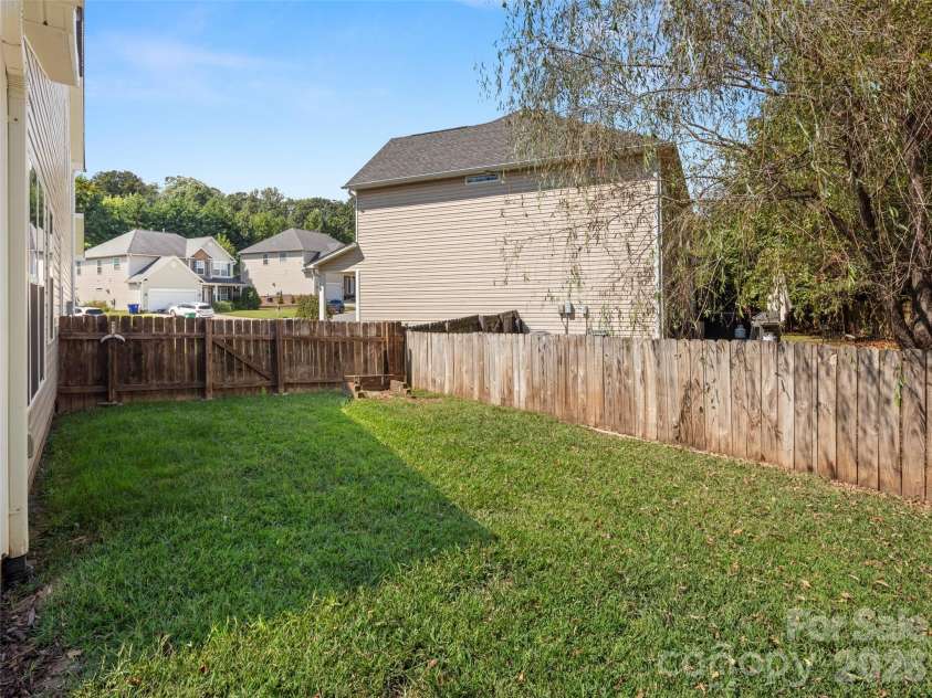 16 Stonebury Drive, Arden, NC 28704.  MLS# CAR4425932, YatesRealty ID 51681. Side Yard