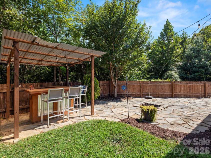 16 Stonebury Drive, Arden, NC 28704.  MLS# CAR4425932, YatesRealty ID 51681. Tiki Hut/Backyard
