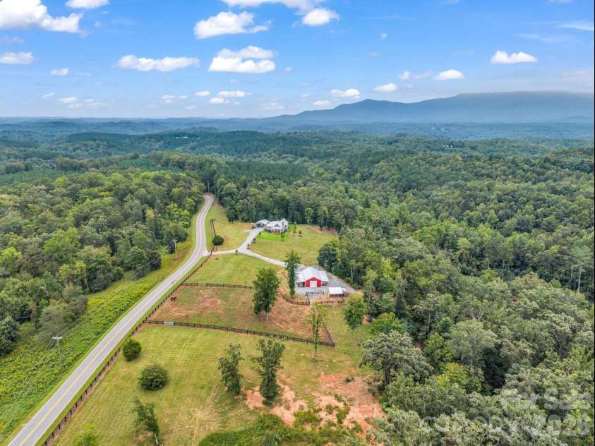 2255 Lake Adger Road, Mill Spring, NC 28756.  MLS# CAR4426062, YatesRealty ID 51693. Compact farm with mountain views