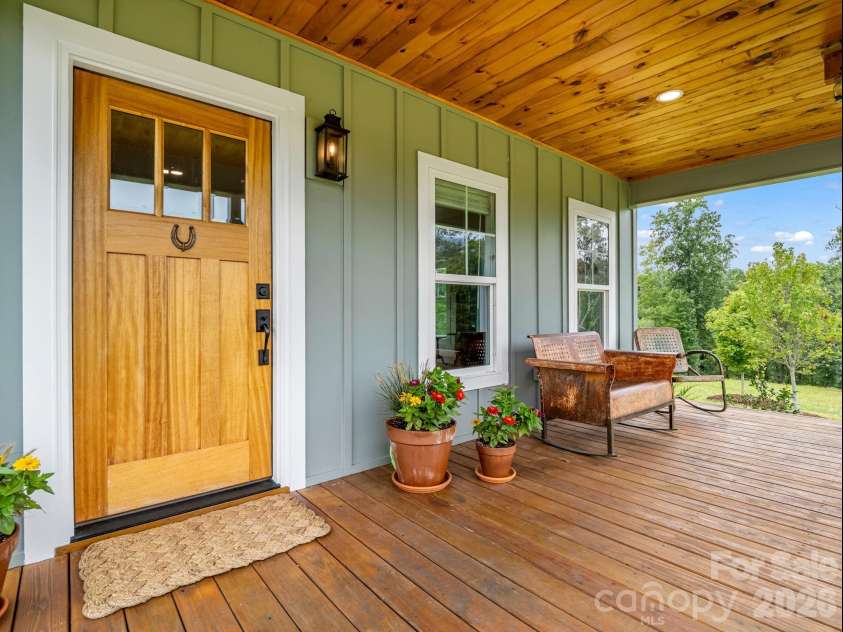 2255 Lake Adger Road, Mill Spring, NC 28756.  MLS# CAR4426062, YatesRealty ID 51693. Covered front porch