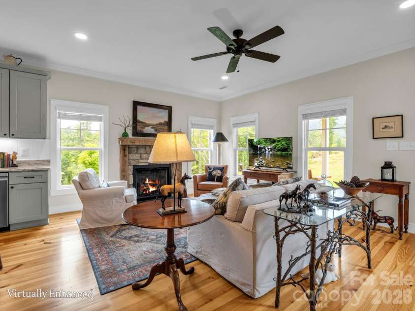 2255 Lake Adger Road, Mill Spring, NC 28756.  MLS# CAR4426062, YatesRealty ID 51693. Great room with gas log fireplace