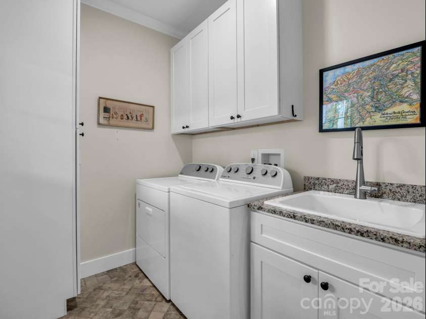 2255 Lake Adger Road, Mill Spring, NC 28756.  MLS# CAR4426062, YatesRealty ID 51693. Laundry room with sink